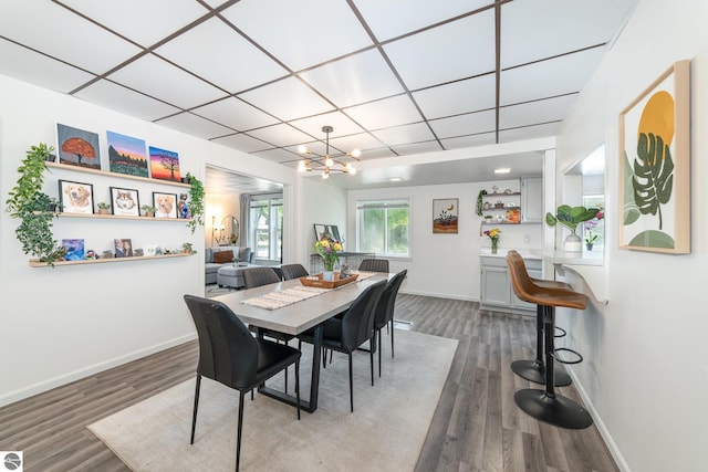 503 N Kinney Ave, Mount Pleasant, MI 48858 - dining area with a chandelier and wood finished floors