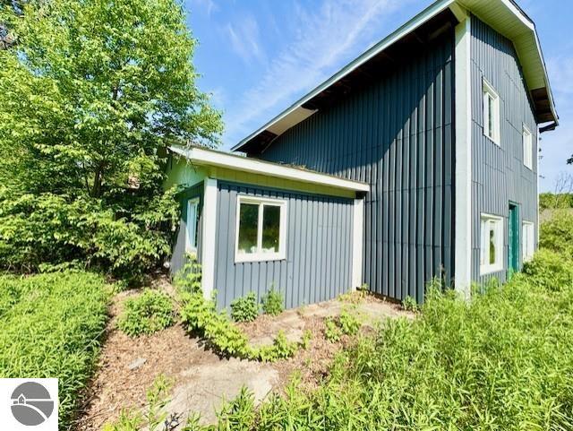 4629 Filter Rd, Harrison, MI 48625 - view of property exterior with board and batten siding