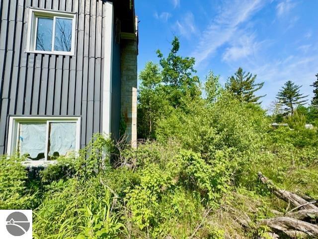 4629 Filter Rd, Harrison, MI 48625 - view of home's exterior with board and batten siding