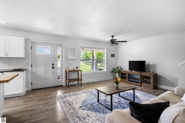 6330 Lund Rd SW, Fife Lake, MI 49633 - living area featuring wood finished floors and a ceiling fan