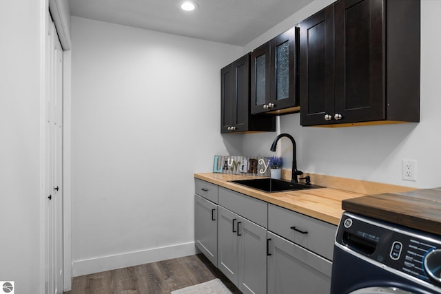 6330 Lund Rd SW, Fife Lake, MI 49633 - kitchen featuring washer / dryer, butcher block counters, dark wood finished floors, and recessed lighting