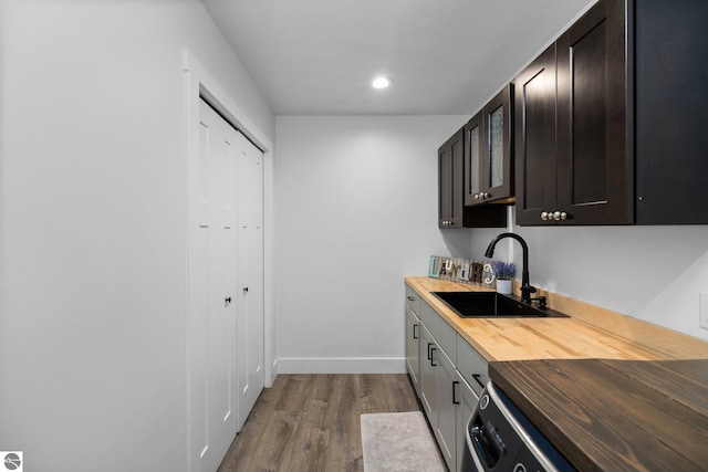 6330 Lund Rd SW, Fife Lake, MI 49633 - washroom featuring dark wood-style floors and recessed lighting