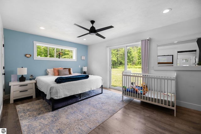 6330 Lund Rd SW, Fife Lake, MI 49633 - bedroom with multiple windows, recessed lighting, wood finished floors, access to exterior, and ceiling fan