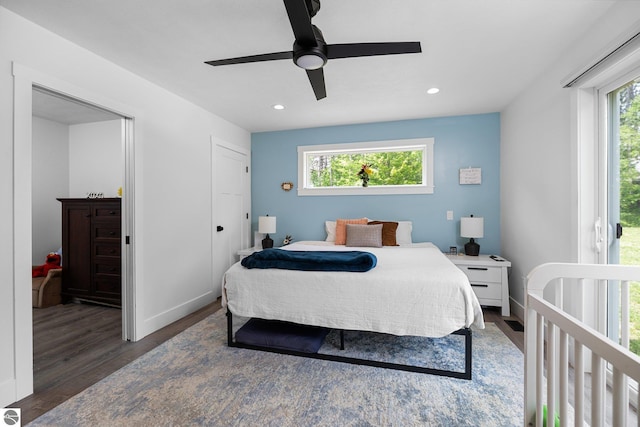 6330 Lund Rd SW, Fife Lake, MI 49633 - bedroom featuring multiple windows, wood finished floors, recessed lighting, and a ceiling fan