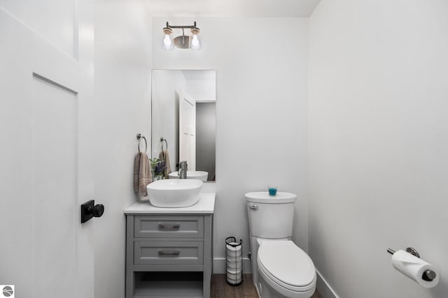 6330 Lund Rd SW, Fife Lake, MI 49633 - half bath with vanity and wood finished floors