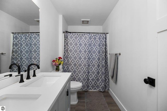 6330 Lund Rd SW, Fife Lake, MI 49633 - full bath with vanity, wood finished floors, and a shower with shower curtain