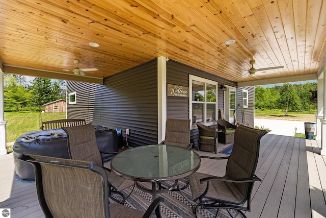 6330 Lund Rd SW, Fife Lake, MI 49633 - wooden terrace with ceiling fan and outdoor dining space