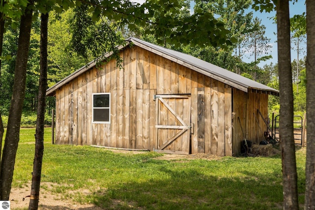 6330 Lund Rd SW, Fife Lake, MI 49633 - view of barn with a lawn