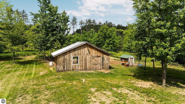 6330 Lund Rd SW, Fife Lake, MI 49633 - view of outbuilding featuring a view of trees