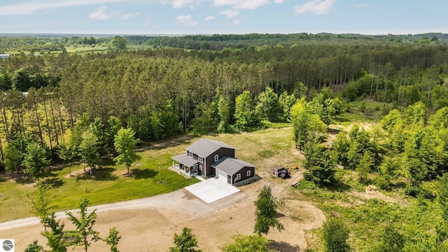 6330 Lund Rd SW, Fife Lake, MI 49633 - aerial view of property and surrounding area featuring a heavily wooded area
