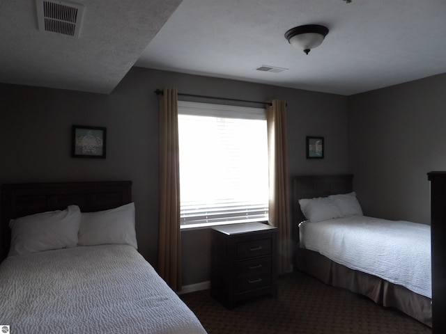 1246 Sunnyside Dr Unit 203, 4 & 8, Cadillac, MI 49601 - bedroom featuring dark carpet and multiple windows