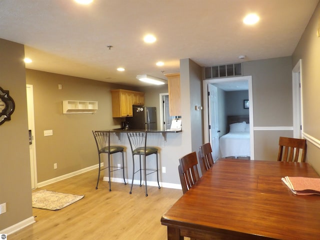1246 Sunnyside Dr Unit 203, 4 & 8, Cadillac, MI 49601 - dining space with light wood-style flooring and recessed lighting