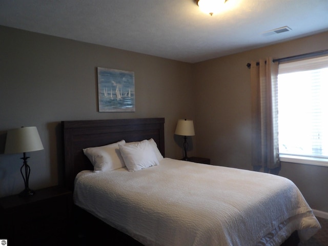 1246 Sunnyside Dr Unit 203, 4 & 8, Cadillac, MI 49601 - bedroom with baseboards