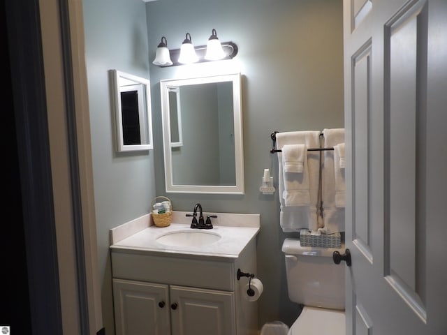 1246 Sunnyside Dr Unit 203, 4 & 8, Cadillac, MI 49601 - bathroom featuring vanity and toilet