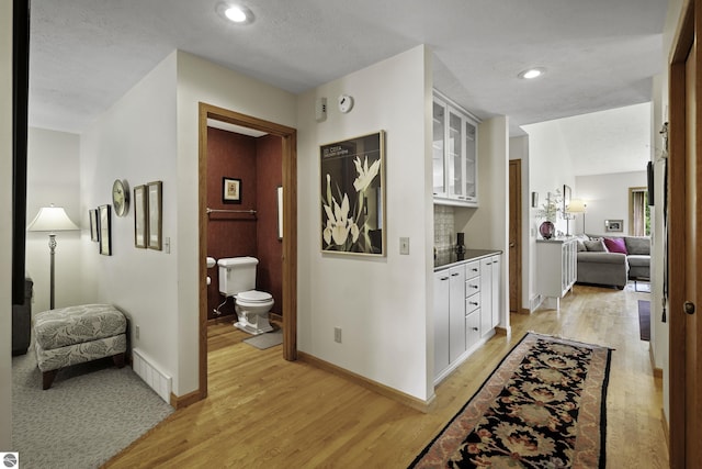 3810 Ridgeway Pl, Traverse City, MI 49684 - hallway featuring light wood finished floors and recessed lighting