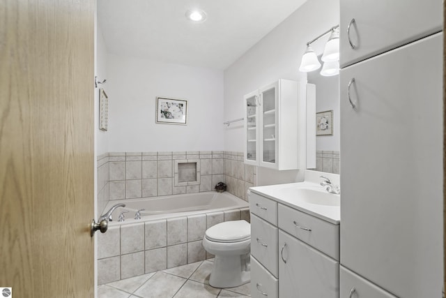 3810 Ridgeway Pl, Traverse City, MI 49684 - full bathroom featuring tile patterned flooring, a garden tub, and vanity