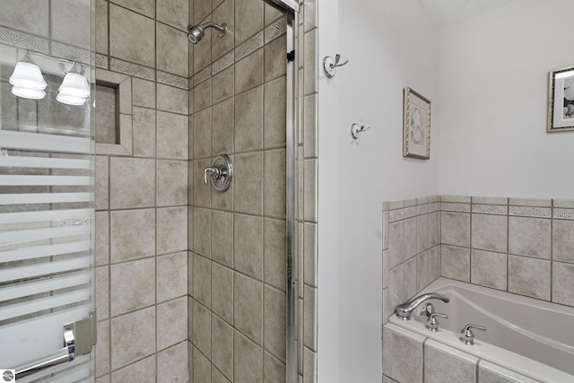3810 Ridgeway Pl, Traverse City, MI 49684 - bathroom with radiator, a bath, and a stall shower