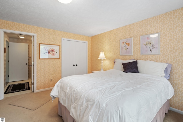 3810 Ridgeway Pl, Traverse City, MI 49684 - carpeted bedroom with wallpapered walls and a closet