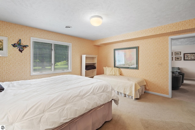 3810 Ridgeway Pl, Traverse City, MI 49684 - carpeted bedroom with wallpapered walls and a textured ceiling