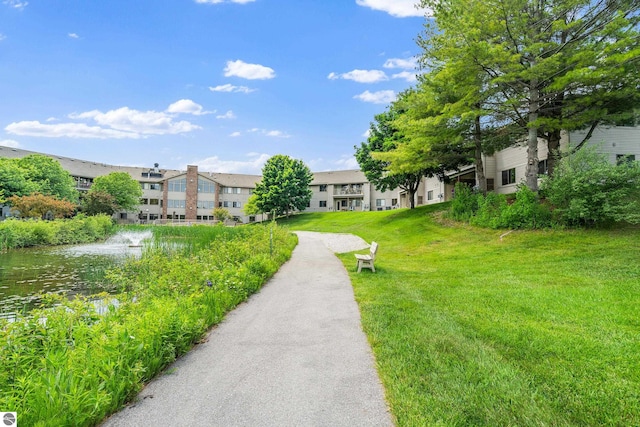 3810 Ridgeway Pl, Traverse City, MI 49684 - view of home's community featuring a yard and a water view