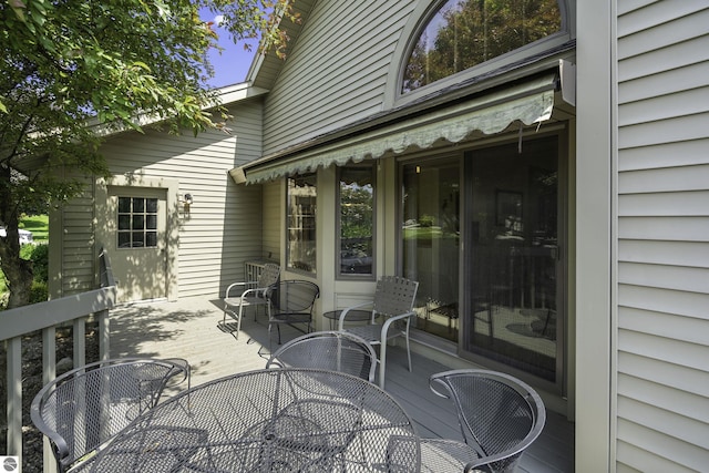 3810 Ridgeway Pl, Traverse City, MI 49684 - wooden deck with outdoor dining area
