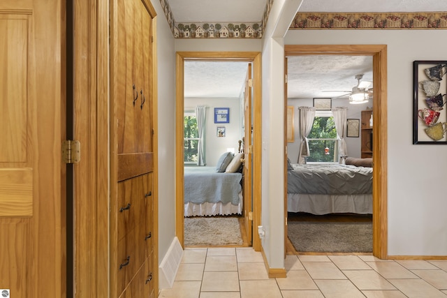 3048 Frankfort Hwy, Frankfort, MI 49635 - hall featuring light tile patterned floors and light carpet