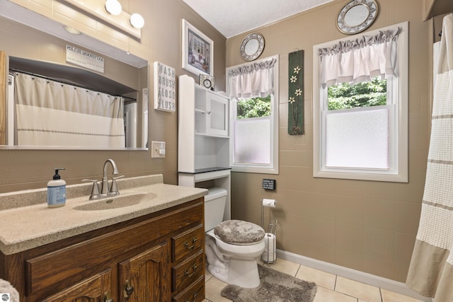 3048 Frankfort Hwy, Frankfort, MI 49635 - bathroom featuring healthy amount of natural light, vanity, and tile patterned flooring