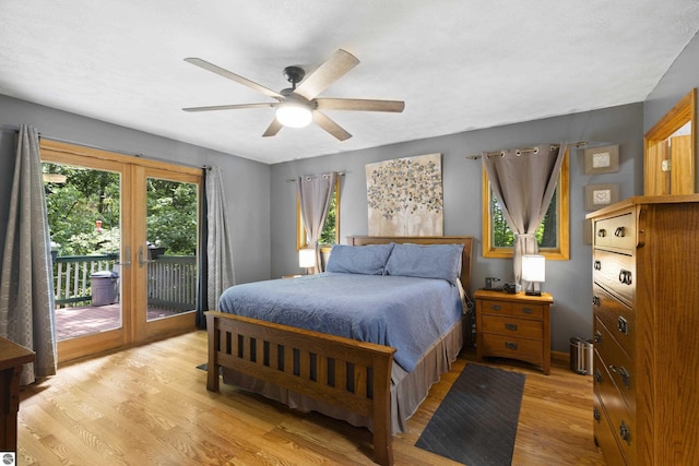 3048 Frankfort Hwy, Frankfort, MI 49635 - bedroom with light wood finished floors, access to outside, french doors, and a ceiling fan
