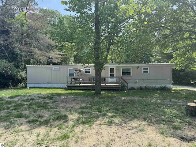 126 Chippewa Trl, Buckley, MI 49620 - rear view of house with a wooden deck