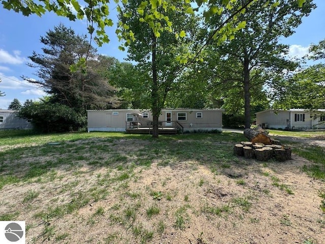 126 Chippewa Trl, Buckley, MI 49620 - view of yard featuring a deck