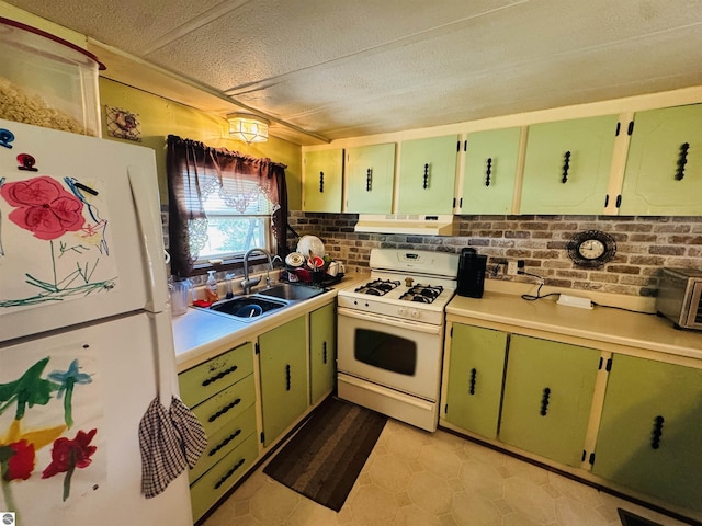 126 Chippewa Trl, Buckley, MI 49620 - kitchen featuring white appliances, under cabinet range hood, light countertops, a textured ceiling, and tasteful backsplash