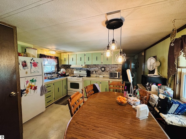 126 Chippewa Trl, Buckley, MI 49620 - kitchen with green cabinetry, white appliances, a textured ceiling, and decorative backsplash