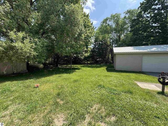 126 Chippewa Trl, Buckley, MI 49620 - view of grassy yard with an outdoor structure