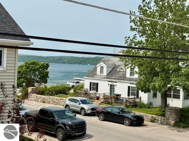 180 S Benzie Blvd, Beulah, MI 49617 - view of vehicle parking with a water view