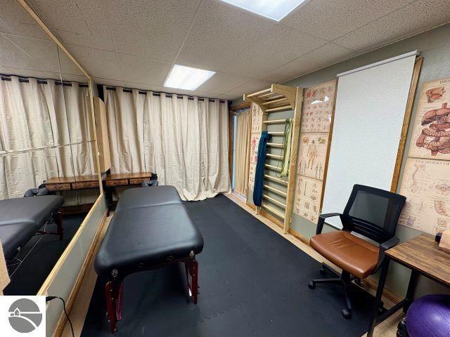 180 S Benzie Blvd, Beulah, MI 49617 - exercise room featuring a paneled ceiling