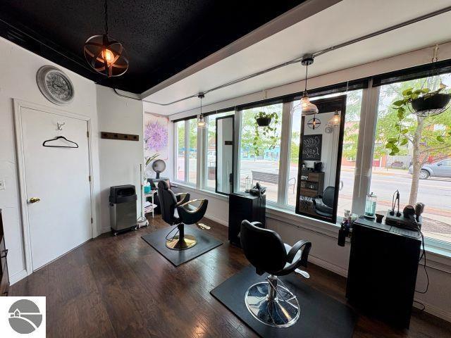 180 S Benzie Blvd, Beulah, MI 49617 - home office featuring dark wood-style floors