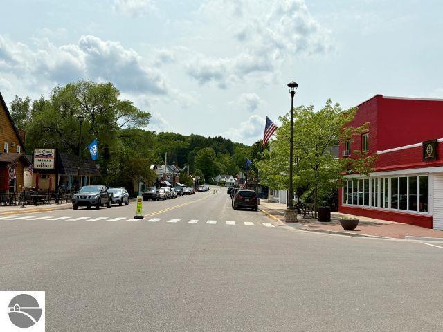 180 S Benzie Blvd, Beulah, MI 49617 - view of asphalt street featuring street lighting, sidewalks, and curbs