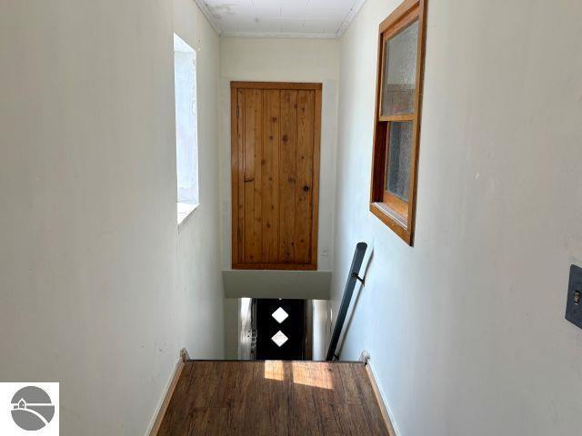 180 S Benzie Blvd, Beulah, MI 49617 - hall with baseboards and crown molding