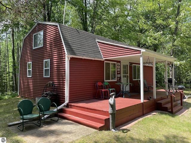 5218 E Laird Lake Rd, Hale, MI 48739 - wooden porch with a lawn