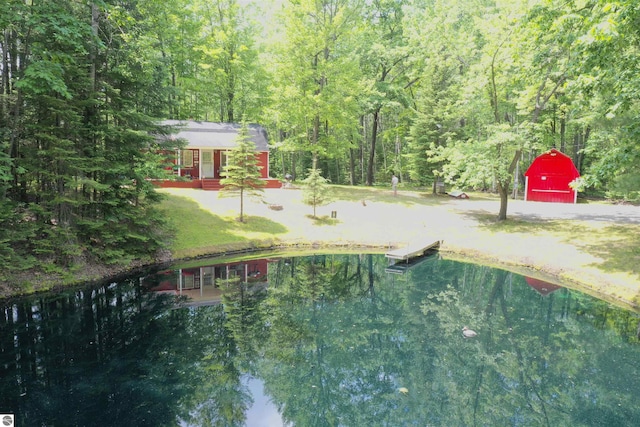 5218 E Laird Lake Rd, Hale, MI 48739 - view of yard with a view of trees and a boat dock