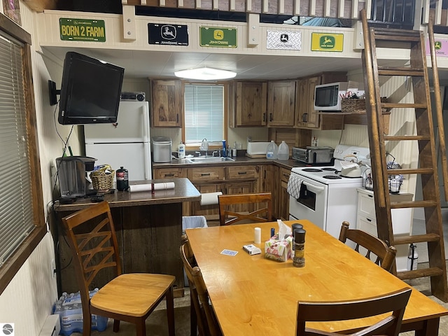 5218 E Laird Lake Rd, Hale, MI 48739 - kitchen with white range with electric cooktop and dark countertops