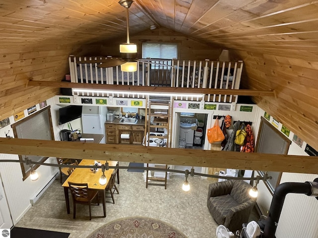 5218 E Laird Lake Rd, Hale, MI 48739 - living area featuring wood walls, wood ceiling, lofted ceiling, and a baseboard radiator