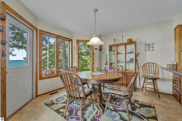 6387 W Maple St, Lake City, MI 49651 - dining space with baseboards