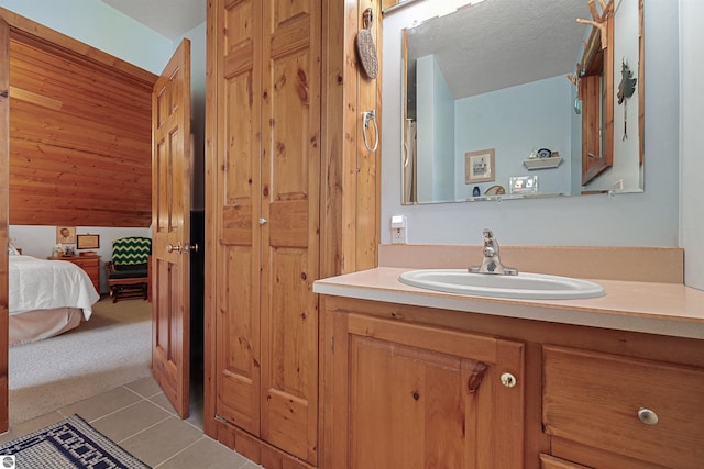 6387 W Maple St, Lake City, MI 49651 - ensuite bathroom with vanity and tile patterned floors