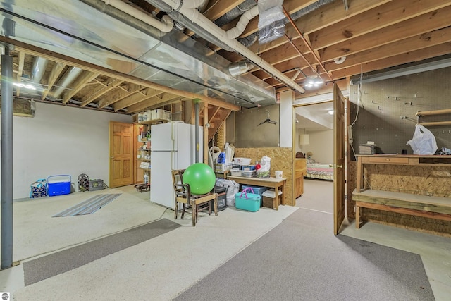 6387 W Maple St, Lake City, MI 49651 - unfinished basement with freestanding refrigerator