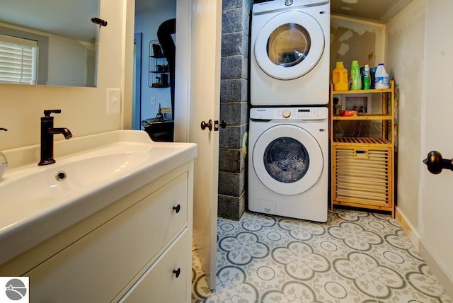 7600 Maple St, Grawn, MI 49637 - washroom with stacked washer / drying machine and baseboards
