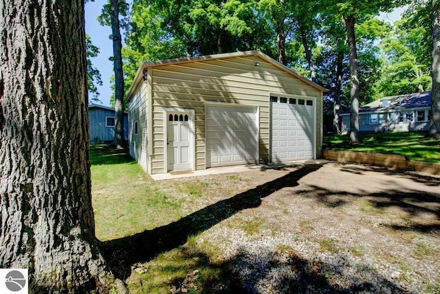 7600 Maple St, Grawn, MI 49637 - view of detached garage