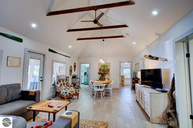7600 Maple St, Grawn, MI 49637 - living room featuring beamed ceiling, light wood-type flooring, high vaulted ceiling, ceiling fan, and recessed lighting