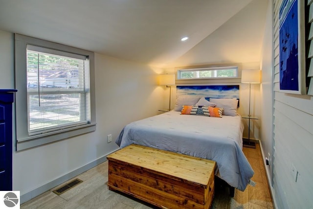 7600 Maple St, Grawn, MI 49637 - bedroom with lofted ceiling and recessed lighting