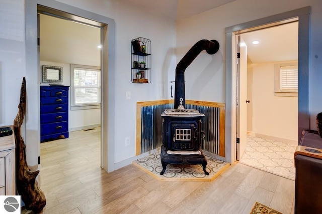 7600 Maple St, Grawn, MI 49637 - detailed view of a wood stove and wood finished floors